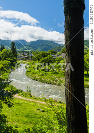 Oide Suspension Bridge, Himekawa River and Hakuba Sanzan as seen from the observation deck at Oide Park in Hakuba Village, Kitaazumi District, Nagano Prefecture, Japan Oide Suspension Bridge, Himekawa River and Hakuba Sanzan as seen from the observation deck at Oide Park in Hakuba Village, Kitaazumi District, Nagano Prefecture, Japan 118028742