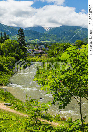 Oide Suspension Bridge, Himekawa River and Hakuba Sanzan as seen from the observation deck at Oide Park in Hakuba Village, Kitaazumi District, Nagano Prefecture, Japan 118028743