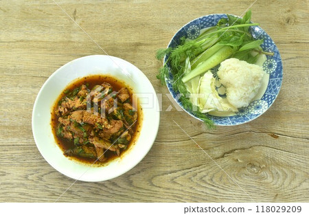 boiled slice beef meat Thai salad taste spicy and sour on plate eat couple sticky rice and fresh vegetable boiled slice beef meat Thai salad taste spicy and sour on plate eat couple sticky rice and fresh vegetable 118029209