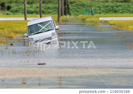 A car submerged in floodwaters caused by heavy rain 118030166