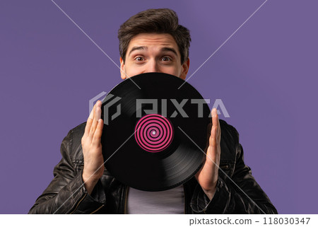 Handsome Man Dancing Vinyl Record Disc On Violet. Hobby, Music Lover, Collection Handsome Man Dancing Vinyl Record Disc On Violet. Hobby, Music Lover, Collection 118030347