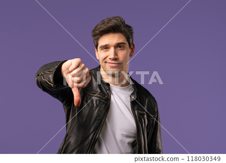 Mature man with sign of dislike, shaming. American dude expressing thumbs-down 118030349