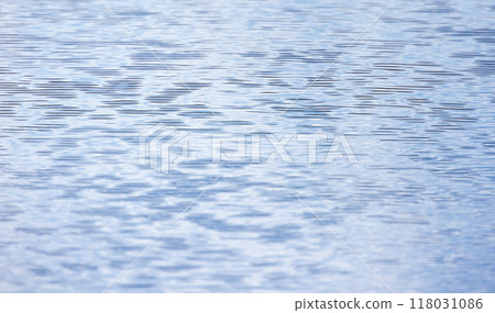 Light blue smooth sea water surface with ripple pattern Light blue smooth sea water surface with ripple pattern 118031086