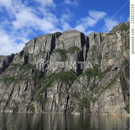 Famous Pulpit Rock Preikestolen seen from Lysefjord below, Norway. Famous Pulpit Rock Preikestolen seen from Lysefjord below, Norway. 118031219