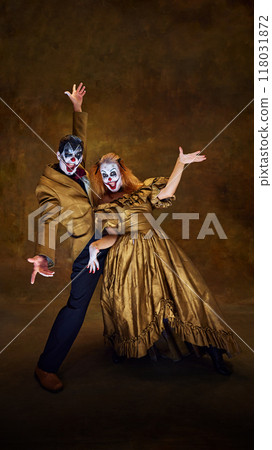 Clowns with frightening make-up posing, their expressions full of character against vintage style background. Concept of Halloween. 118031872