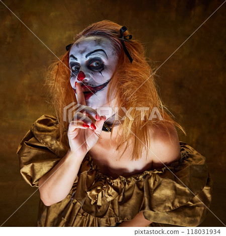 Woman with frightening make-up in old-fashioned dress, making shh gesture, playfully ominous against vintage background. Woman with frightening make-up in old-fashioned dress, making shh gesture, playfully ominous against vintage background. 118031934
