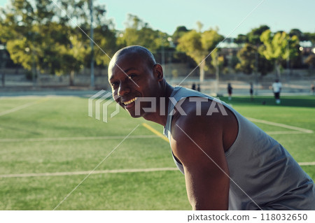 Atheltic man posing for camera, soccer field on background Atheltic man posing for camera, soccer field on background 118032650