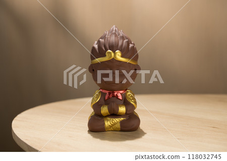 Sun Wukong doll meditates, cute ceramics charm. Sun Wukong doll meditates, cute ceramics charm. 118032745