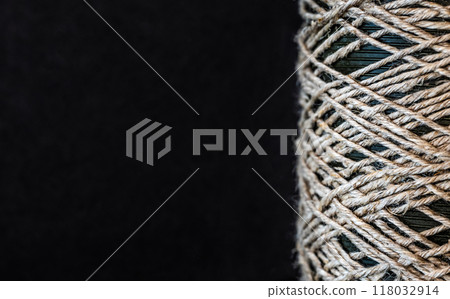 Rope coil on dark background Rope coil on dark background 118032914