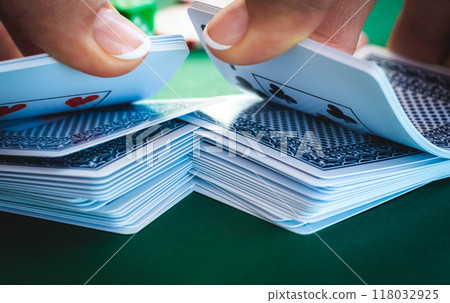 Croupier shuffling playing cards Croupier shuffling playing cards 118032925
