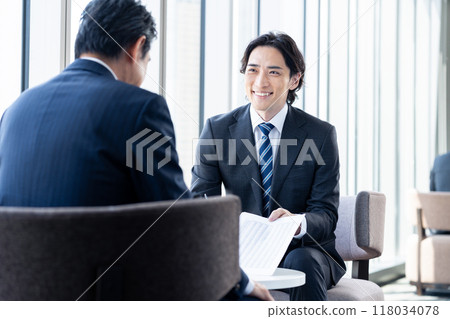 Businessmen discussing business. Photo courtesy of Denpa Gakuen, Tokyo Electronics College. Businessmen discussing business. Photo courtesy of Denpa Gakuen, Tokyo Electronics College. 118034078