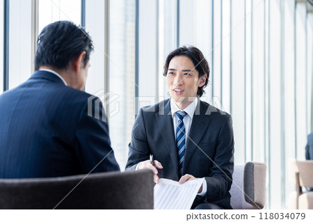 Businessmen discussing business. Photo courtesy of Denpa Gakuen, Tokyo Electronics College. Businessmen discussing business. Photo courtesy of Denpa Gakuen, Tokyo Electronics College. 118034079