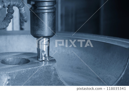 The CNC milling machine rough cutting the cast iron mold parts by indexable tools in the light blue scene. 118035341