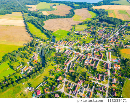 This aerial perspective showcases the picturesque rural landscape around Trebon, Czechia, highlighting the harmonious blend of winding rivers, lush fields, and charming village homes nestled in the This aerial perspective showcases the picturesque rural landscape around Trebon, Czechia, highlighting the harmonious blend of winding rivers, lush fields, and charming village homes nestled in the 118035471