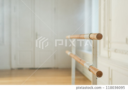 Empty ballet dance studio with barre. Professional ballet barre for stretching practicing dancing positions in dance school Dance hall ready for ballet class training. Ballet school 118036095