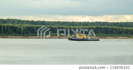A large cargo sea vessel is at anchor, a dry cargo ship is at anchor A large cargo sea vessel is at anchor, a dry cargo ship is at anchor 118036102