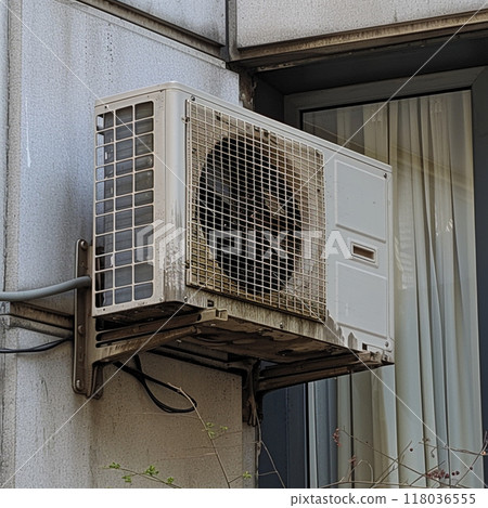 A grime-covered air conditioning unit mounted on the exterior of a building. A grime-covered air conditioning unit mounted on the exterior of a building. 118036555