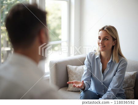 Therapy session in a cozy, natural light environment Therapy session in a cozy, natural light environment 118036592