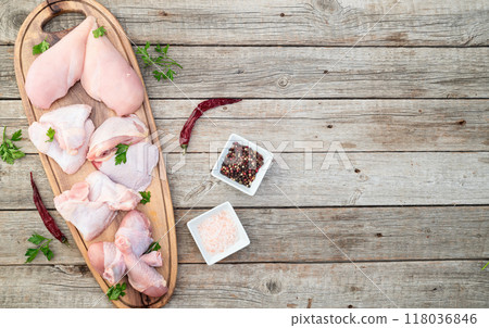 Raw mixed chicken meat parts  for cooking on rustic background 118036846