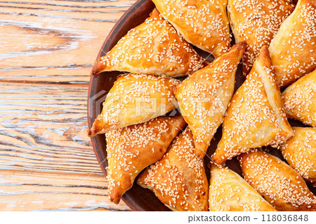 Homemade triangle puff pastry with meat on rustic background . Samosa 118036848