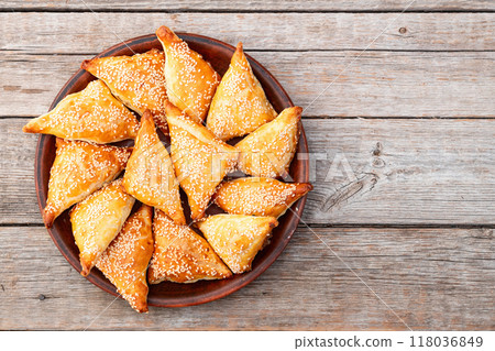 Homemade triangle puff pastry with meat on rustic background . Samosa Homemade triangle puff pastry with meat on rustic background . Samosa 118036849