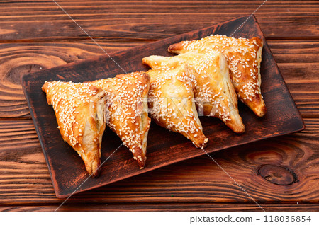Homemade triangle puff pastry with meat on rustic background . Samosa 118036854