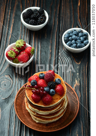 Stack of homemade american pancakes with berries . Top view Stack of homemade american pancakes with berries . Top view 118037050