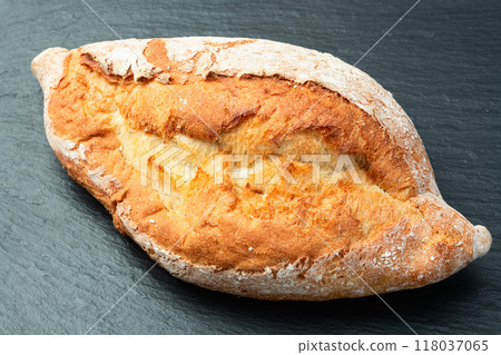 Loaf of  wheat hearth bread . Top view 118037065