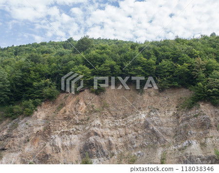 soil erosion under the forest. open trees roots due to landslides. High quality photo soil erosion under the forest. open trees roots due to landslides. High quality photo 118038346