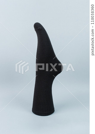 Black cotton sock on grey background. advertising, logo, branding. Black cotton sock on grey background. advertising, logo, branding. 118038360