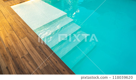 Swimming pool entrance steps with clean blue water at modern villa 118039620
