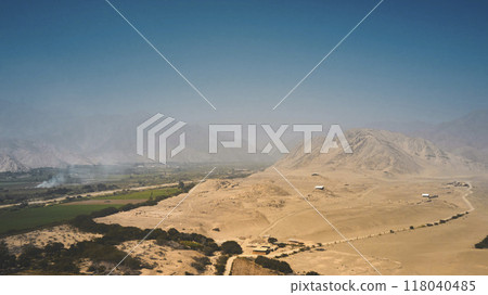 Panoramic view the ancient archaeological site of Caral, near Supe, Barranca Province, Peru. Caral is a UNESCO world heritage site and considered to be the oldest city in the Americas. Panoramic view the ancient archaeological site of Caral, near Supe, Barranca Province, Peru. Caral is a UNESCO world heritage site and considered to be the oldest city in the Americas. 118040485