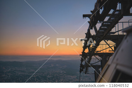 Closeup, Modular cabins cable car against the bright sky, clouds and mountains. Cableway - one of the popular urban rides in Caracas. toned image. 118040532