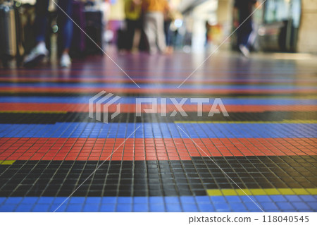 Airport floor and unrecognizable people at the international airport Simon Bolivar, Caracas Venezuela. Art by Carlos Cruz Diez 118040545