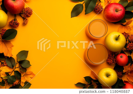 Autumn flat lay with vibrant apples, a cup of tea, and colorful leaves. Concept of autumn, coziness, and harvest season 118040887
