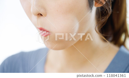 A woman using her tongue to massage away nasolabial folds A woman using her tongue to massage away nasolabial folds 118041361