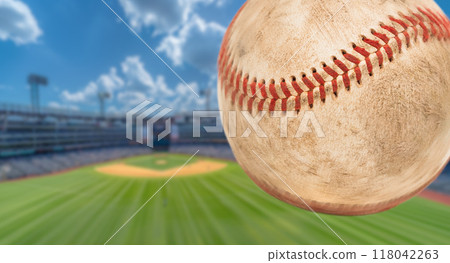 Baseball Flying Through The Air with Stadium in the Background. Baseball Flying Through The Air with Stadium in the Background. 118042263