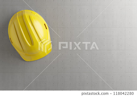Overhead of Yellow Hard Hat on Cement Background with Room for Text. Overhead of Yellow Hard Hat on Cement Background with Room for Text. 118042280