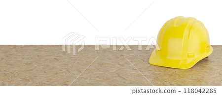 Yellow Construction Hard Hat Resting on Particleboard Banner Isolated on a White Background. 118042285