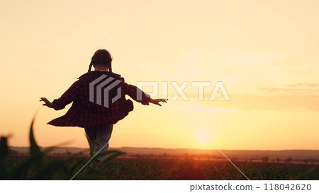 silhouette child farmer daughter runs playing field sunset, agriculture, playing airplane pilot agricultural field, little girl runs rubber boots through corn sprouts, children dream happy family silhouette child farmer daughter runs playing field sunset, agriculture, playing airplane pilot agricultural field, little girl runs rubber boots through corn sprouts, children dream happy family 118042620