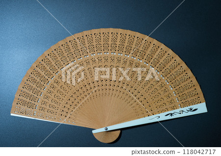 Japanese clothing accessory, folding fan, black background 118042717