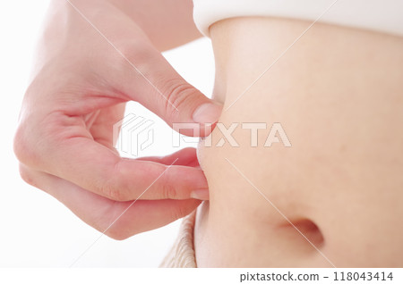 A stomach of a woman who succeeded in dieting A stomach of a woman who succeeded in dieting 118043414