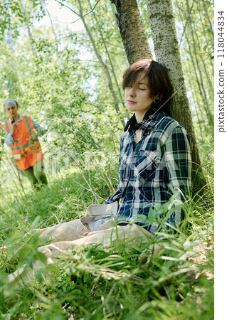 Unconscious female camper in casualwear 118044834