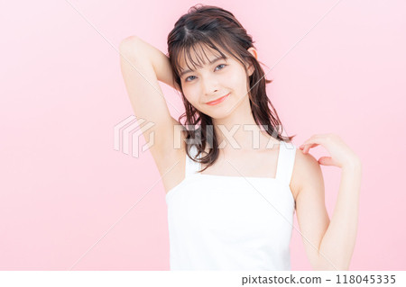 Young woman doing skin care with pink back 118045335