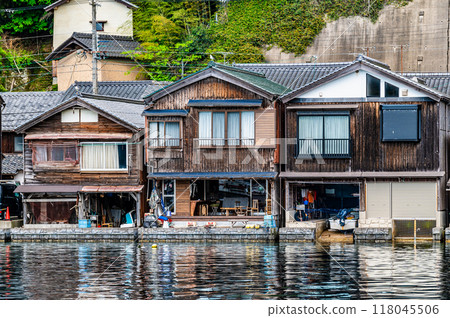 Boathouses in Ine, Kyoto: A group of boathouses lined up along the coast Boathouses in Ine, Kyoto: A group of boathouses lined up along the coast 118045506