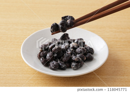 Pick up black soybean natto with chopsticks Pick up black soybean natto with chopsticks 118045771