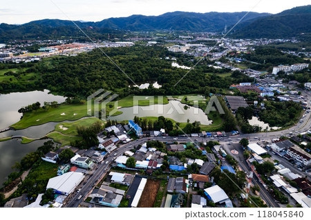 Aerial view of residential houses and driveways neighborhood during in sunny time.Tightly packed homes.Top view over building houses in phuket thailand 118045840