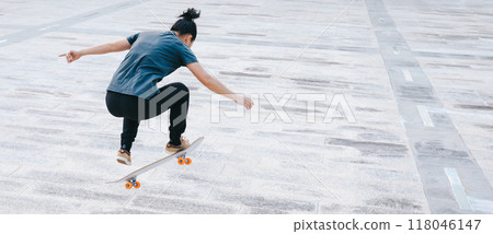 Skateboarder skateboarding outdoors in city 118046147