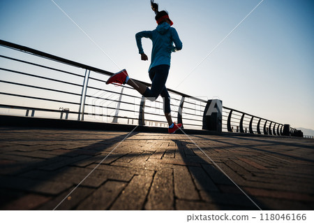 Fitness woman runner running at seaside 118046166