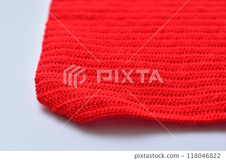 red wool knitted yarn texture, woolen fabric on white background red wool knitted yarn texture, woolen fabric on white background 118046822